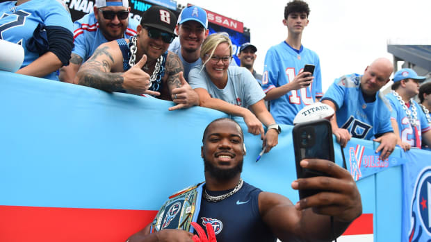 Tennessee Titans linebacker Azeez Al-Shaair (2) takes a selfie with fans before the game against the Atlanta Falcons at Nissan Stadium. Mandatory Credit: Christopher Hanewinckel-USA TODAY Sports